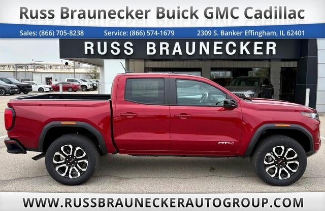 2026 GMC Canyon AT4 in Volcanic Red Tintcoat — front three-quarter view